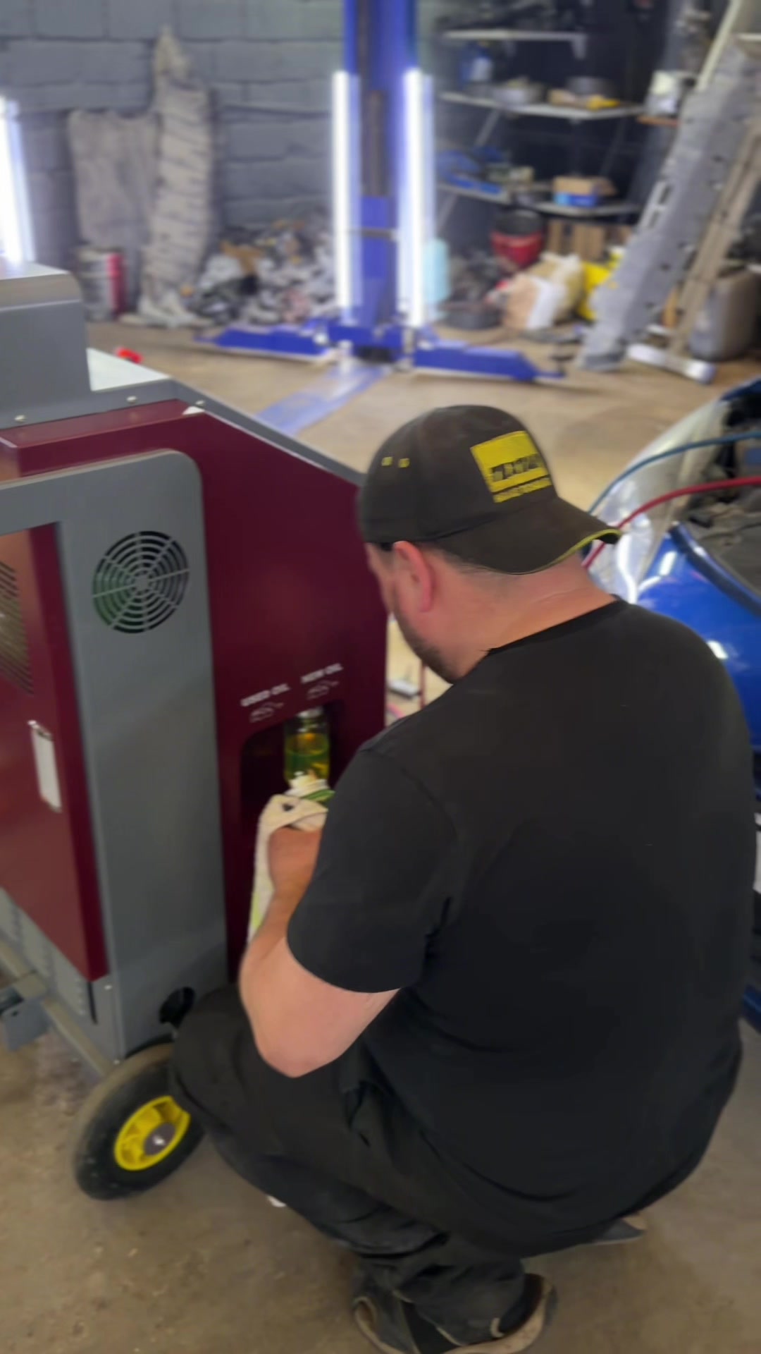Technician servicing the auto AC
